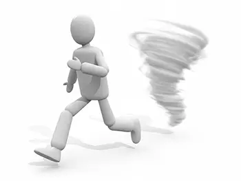 竜巻(トルネード)から走って逃げている人物のイラスト