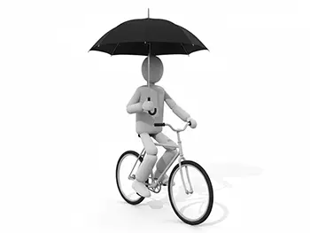 自転車に乗りながら傘差し運転をしている人物のイラスト