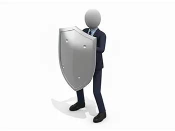 大きな盾を両手で構えて防御の姿勢をとるスーツ姿のビジネスマン