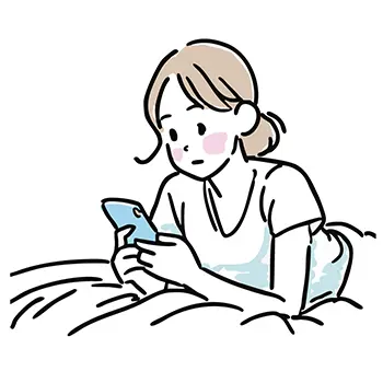 ベッドで寝ながらスマートフォンを見る女性の無料イラスト
