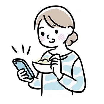 食事をしながらスマートフォンを笑顔で見る女性の無料イラスト