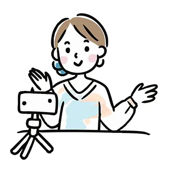 三脚に立てたスマートフォンに向かって笑顔で動画撮影（配信）する女性の無料イラスト