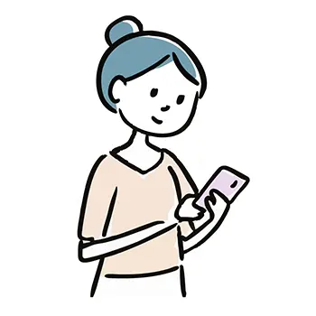 笑顔でスマートフォンを操作するお団子ヘアの女性の無料イラスト