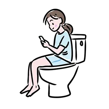 トイレの便座に座りながらスマートフォンを操作する女性の無料イラスト