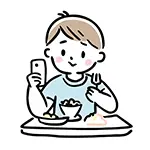 【無料イラスト】食事中にスマホを笑顔で見る男の子 | 商用利用OK・フリー素材