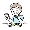 食事をしながらスマートフォンを笑顔で見る男の子の無料イラスト