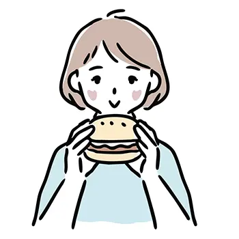 ハンバーガーを両手で持って美味しそうに食べる女性のフリー素材。