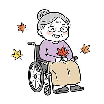  車椅子に乗り、紅葉の葉を持って微笑むおばあさんのイラスト。秋のイメージ。