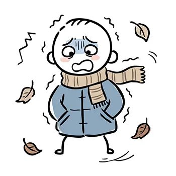  コートとマフラー姿の人が、秋の木枯らし（冬）の寒さでガタガタと震えているイラスト。