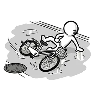 水たまりやマンホールでスリップして転んでしまう自転車
