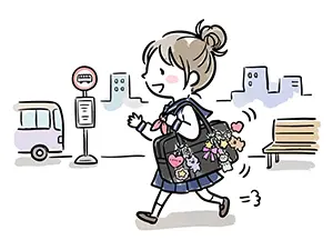 たくさんのキーホルダーを付けた鞄を持ちバス停の横を歩く女子学生のイラスト