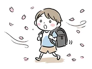 舞い散る桜の花びらの中をランドセルを背負って歩く男の子のイラスト