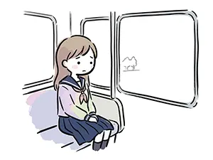 電車の座席に座り物思いにふけりながら窓の外の景色を見つめる女子中高生