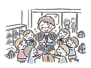 教室で生徒たちに囲まれ花束やプレゼントを受け取って涙ぐむ男性教師